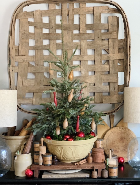 a tree in the kitchen with bowling pins
