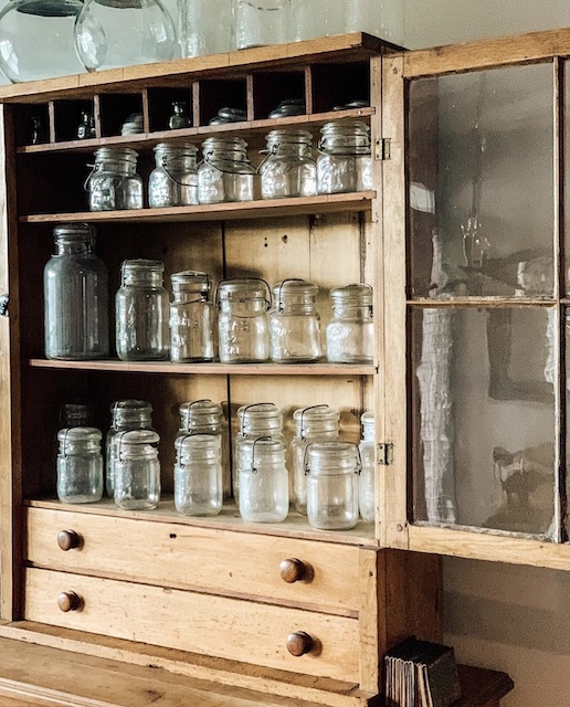 the same cabinet full of mason jars in the dinging room