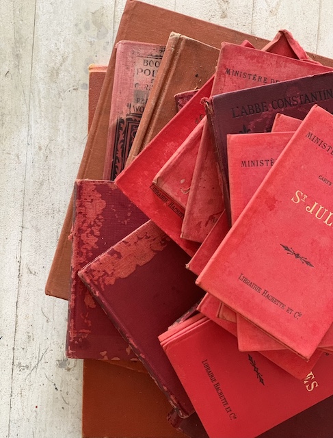 a stack of old red books