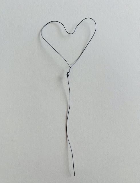 pushing the center of the wire heart into a heart