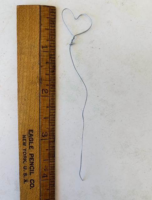 a ruler next to the snippet of wire that I snipped to make my Easy Wire Hearts With Nail Polish
