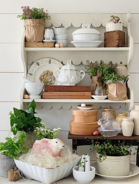 white scalloped shelves all dolled up for easter sharing here in my vintage Easter Home Tour