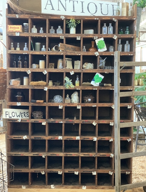 a lot of cubbies filled with antique and vintage finds