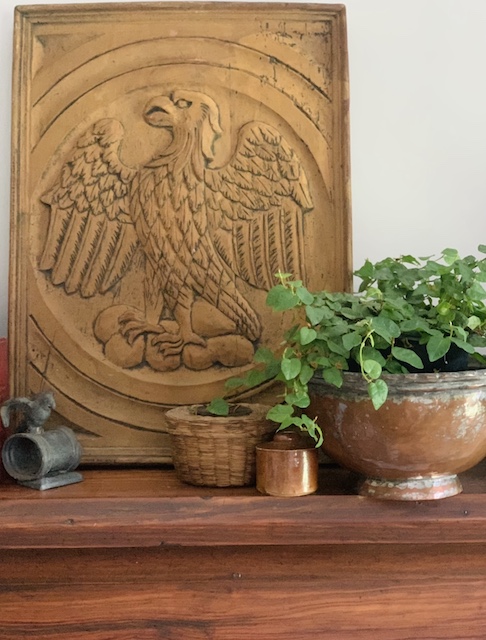 a carved eagle wall hanging