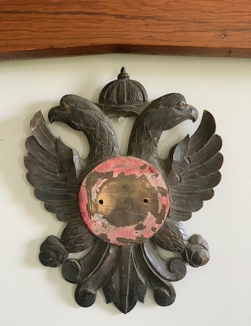 an old eagle fragment hanging on the wall