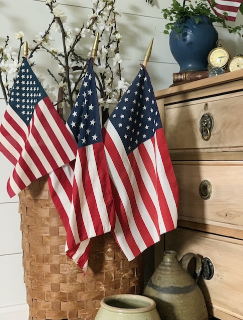 three older American flags in a basket showing how to How To Display And Respect Our Flag