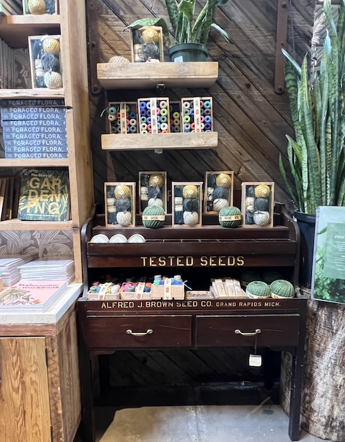 use of an old seed display that terrain used for a yarn display