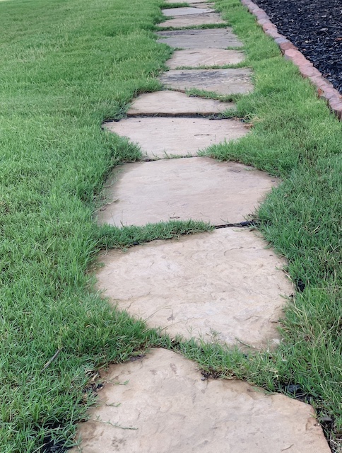 the cottage style stone path all filled in