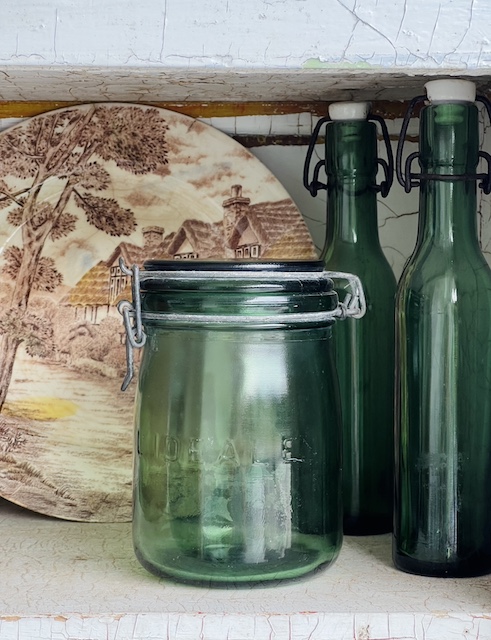 three green glass items that I used in this shelf styling refresh