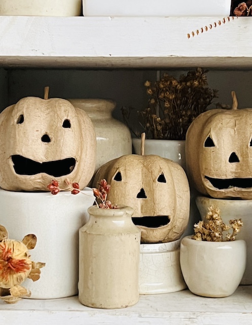 three little neutral paper mache pumpkins 