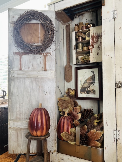  view from the side of the white cabinet for this simple fall styling