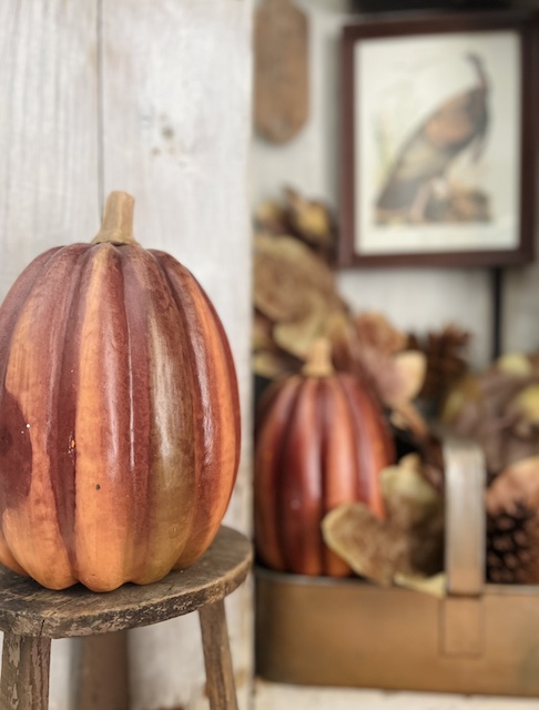 copper pumpkins decorated for the simple fall cabinet styling