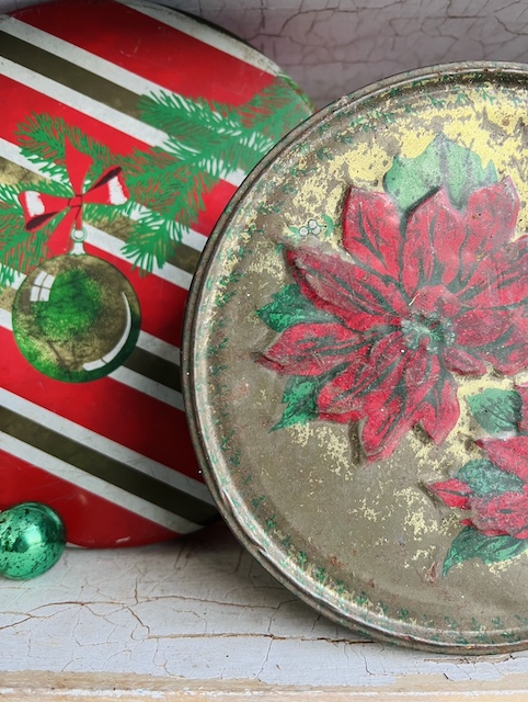 close up of holly vintage Christmas tin