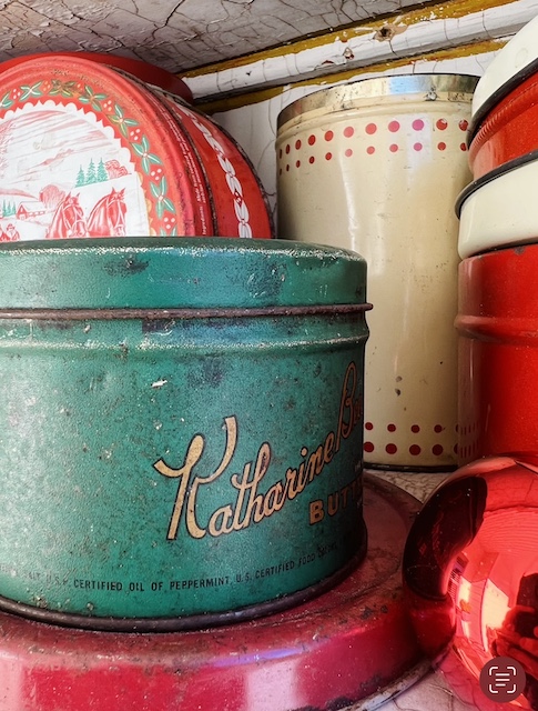 stacking the vintage Christmas tins