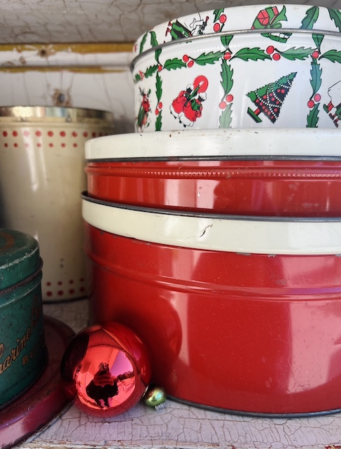 a stack of lids flipped for the vintage Christmas Tin 